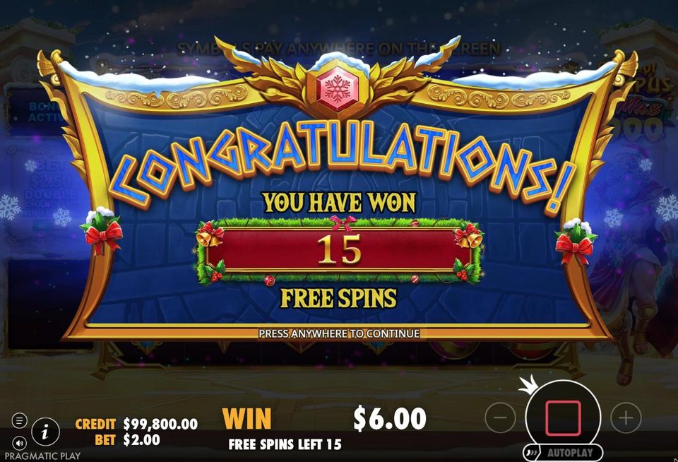 The Gates of Olympus Xmas 1000 award screen in a gold frame trimmed with snow, holly, red bows and bells: Congratulations, you have won 15 free spins, with a 6 dollar win shown below.
